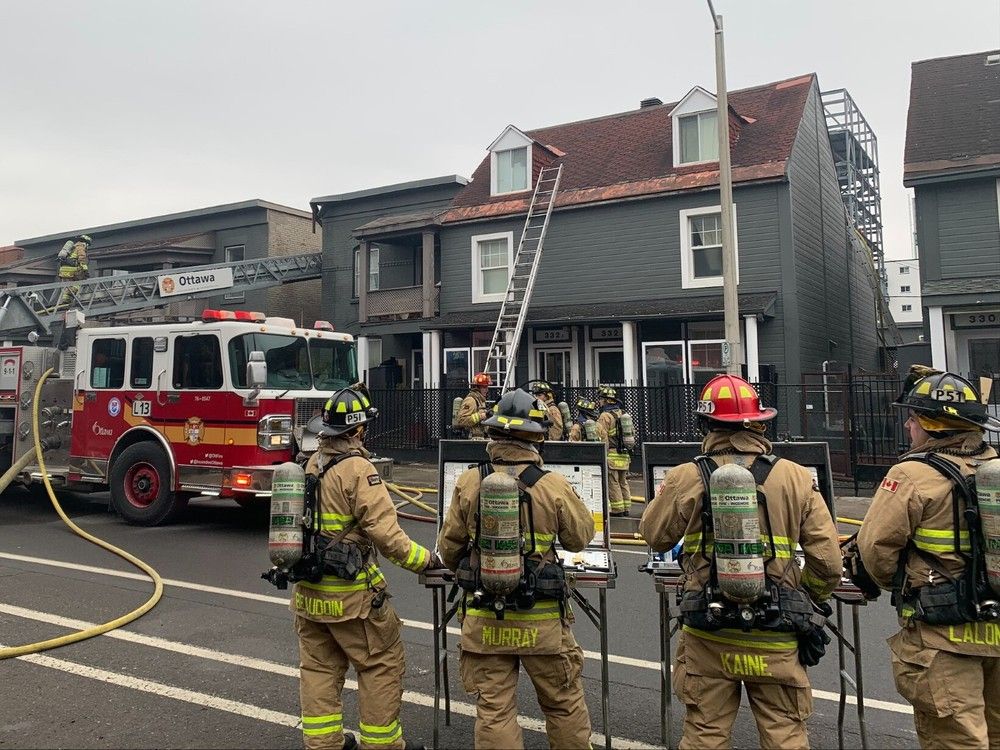 Firefighters work at the scene of a fire on St. Patrick Street on Monday, Dec. 25, 2023. Marlo Glass, Postmedia