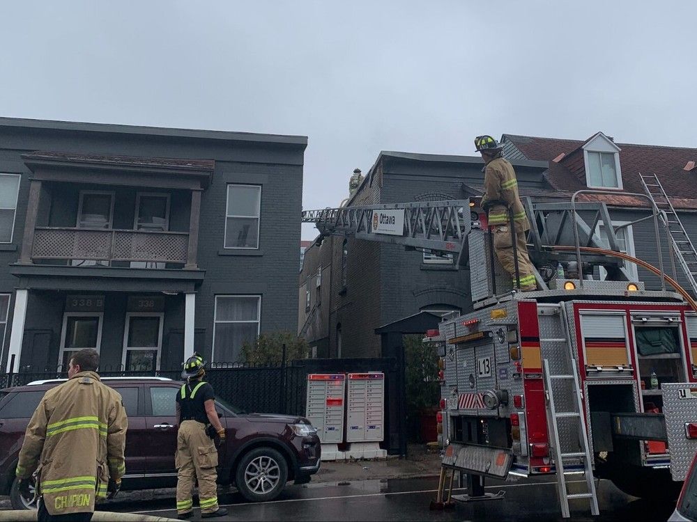 Firefighters work at the scene of a fire on St. Patrick Street on Monday, Dec. 25, 2023. Marlo Glass, Postmedia