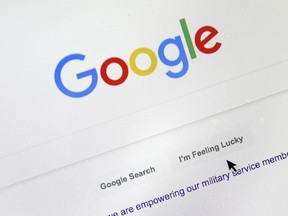 A cursor moves over Google's search engine page.