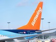 A Sunwing Airlines aircraft parked at the Montréal–Trudeau International Airport.