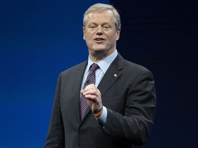 FILE - Incoming NCAA president Charlie Baker speaks during the NCAA Convention, Thursday, Jan. 12, 2023, in San Antonio. Baker wants to create a new tier of Division I where athlete can be paid by schools. The new subdivision for schools with the most athletic resources could offer unlimited educational benefits, enter into name, image and likeness partnerships with athletes and compensate them through a trust fund