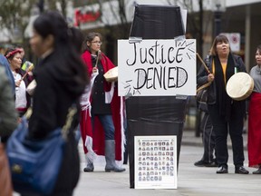 Women outside the missing women inquiry in Vancouver in 2011. Advocates of victims of serial killer Robert Pickton are opposed to applications filed by the RCMP to destroy or return thousands of pieces of evidence.