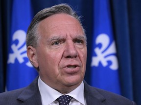 Quebec Premier François Legault comments at the legislature in Quebec City, Tuesday, Oct. 3, 2023.