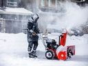 Ty Zorn was using a snowblower to remove the snow from the driveway of his Stittsville home. 
 Residents of Ottawa woke up to a large amount of snow Saturday, Jan. 12, 2024, after a major overnight winter storm.