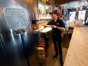 Adrian Assad fires up the wood pizza oven at THE GRAND Pizzeria & Bar in the ByWard Market this week.