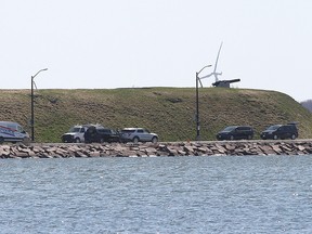 Police officers attend the scene where a pickup truck carrying four officer cadets entered the water at Point Frederick, Royal Military College, on April 29, 2022. The cadets drowned as a result.
