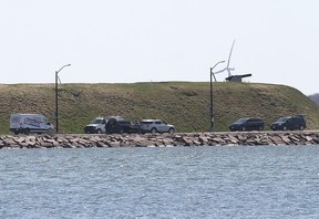 Police officers attend the scene where a pickup truck carrying four officer cadets entered the water at Point Frederick, Royal Military College, on April 29, 2022. The cadets drowned as a result.