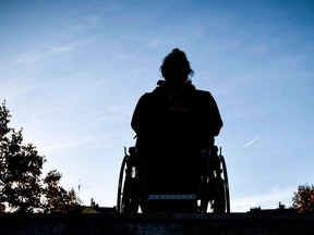 silhouette of person in wheelchair