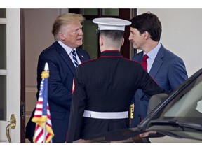 Donald Trump shakes hands with Justin Trudeau at the West Wing of the White House in June 2019.