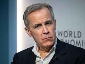 Former Bank of Canada governor Mark Carney listens during a session at last year's World Economic Forum in Davos, January 17, 2023.