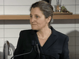A screenshot shows Finance Minister Chrystia Freeland taking a question in Toronto Thursday