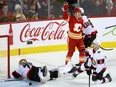 Calgary Flames Yegor Sharangovich scores on Ottawa Senators goalie Joonas Korpisalo