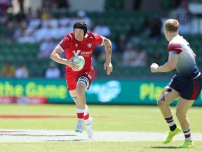 PERTH, Australia – Canadian Jake Thiel, left, attacks the Britain defence on Day 3 of the HSBC Perth SVNS rugby sevens tournament in Perth, Australia, in a Sunday, Jan. 28, 2024, handout photo.