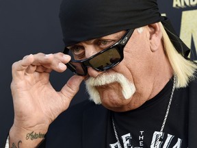 Retired Hulk Hogan and a friend rescued a teenage girl who was trapped in an overturned vehicle after a crash in Florida.