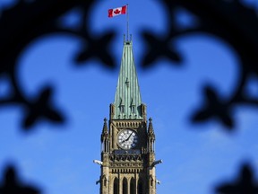 The Canada flag flies atop the Peace Tower on Parliament Hill in Ottawa on Friday, May 5, 2023.