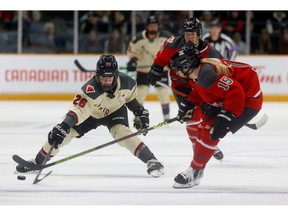 Ottawa’s Savannah Harmon tries to get the puck past Montreal’s Sarah Bujold during second period action. TONY CALDWELL, Postmedia.