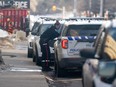Members of the Ottawa Police Service work the scene of a shooting in the Dow's Lake area on Monday, Jan. 29, 2024.