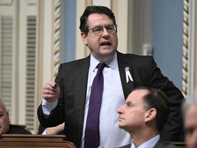 FILE: Quebec Education Minister Bernard Drainville responds to the opposition during question period, Thursday, Nov. 30, 2023, at the legislature in Quebec City.