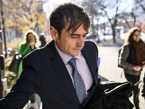 Cameron Jay Ortis arrives for his trial at the courthouse in Ottawa, Thursday, Nov. 16, 2023.