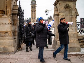 A group from the Jewish community gathered on Parliament Hill and marched to the Embassy of Qatar on Metcalfe Street, Sunday, Feb. 4, 2024.