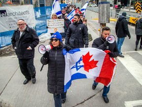 A group from the Jewish community gathered on Parliament Hill and marched to the Embassy of Qatar on Metcalfe Street, Sunday, Feb. 4, 2024.