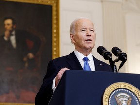 U.S. President Joe Biden speaks at a microphone