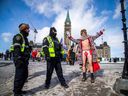 Hundreds of convoy protesters returned to Parliament Hill Saturday, Feb. 17, 2024, on the two-year anniversary of the invocation of the Emergencies Act that ended the protest. A man with very little clothing, who was here for the original protests in similar outfits, returned to the hill.