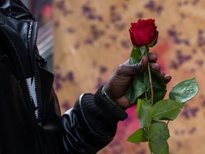 Man holding rose for Valentine's Day