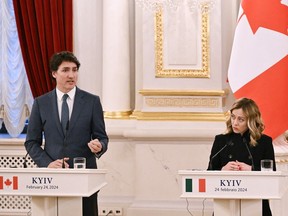 Prime Minister Justin Trudeau addresses media next to Italy's Prime Minister Giorgia Meloni during a joint press conference in Kyiv on Feb. 24, 2024. They were two of four leaders to visit Ukraine on the second anniversary of the Russian invasion of the country.