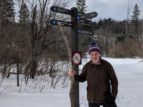 Randy Boswell holds a stick in Gatineau Park