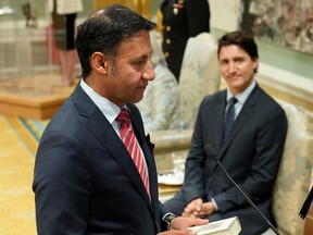 Minister of Justice and Attorney General of Canada Arif Virani takes the oath of office as Prime Minister Justin Trudeau looks on, July 26, 2023.