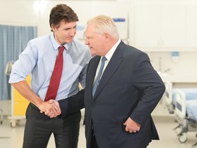 Prime Minister Justin Trudeau and Ontario Premier Doug Ford shake hands