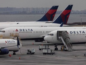 Delta Airlines passenger aircrafts are seen on the tarmac of John F. Kennedy International Airpot in New York,on December 24, 2021