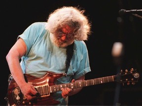 Jerry Garcia plays guitar.