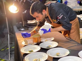 Chef Raghav Chaudhary of Aiana Restaurant Collective in Ottawa puts finshing touches on his dish at the 2024 Canadian Culinary Championship, at the Shaw Centre, on Saturday, Feb. 3, 2024.