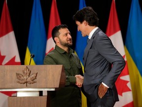 Ukrainian President Volodymyr Zelenskyy, left, and Prime Minister Justin Trudeau shake hands at a joint press conference on Parliament Hill in Ottawa on Friday, Sept. 22, 2023.