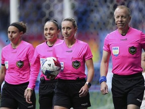 Referee Tori Penso, second from right; fourth official Felisha Mariscal, second from left; and assistant referees Brooke Mayo, left, and Corey Rockwell, right, walk onto the field before the Vancouver Whitecaps and Colorado Rapids played in an MLS soccer match Saturday, April 29, 2023, in Vancouver.