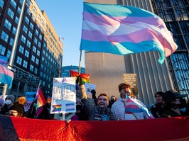 Pro-LGBTQ2+ protesters are seen during a rally outside of an event Alberta Premier Danielle Smith attended in Ottawa on Monday, Feb. 5, 2024.