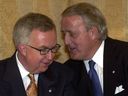 Then-Tory leader Joe Clark and former Prime Minister Brian Mulroney chat at a party fundraiser in Montreal in 2000.