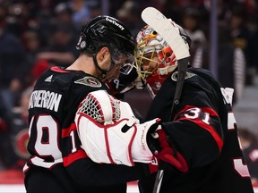 Drake Batherson and Anton Forsberg of the Ottawa Senators celebrate a 2-0 win against the Chicago Blackhawks.