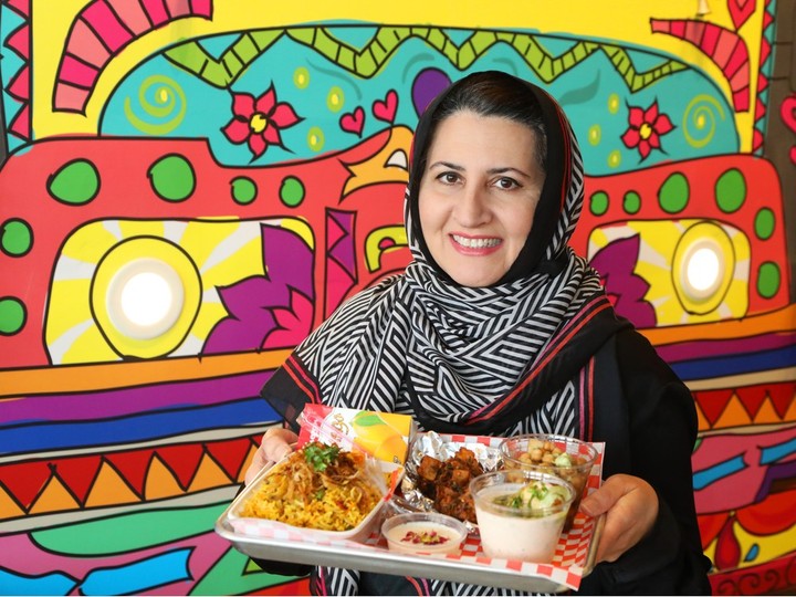  Khokha Eatery’s Zermina Siddiqi holds an Iftar box, filled with food including chicken biryani that is meant for breaking the daily fast during Ramadan, after sunset each day.