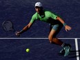 Novak Djokovic of Serbia returns a shot to Aleksandar Vukic of Australia during the BNP Paribas Open at Indian Wells Tennis Garden on March 09, 2024 in Indian Wells, California.