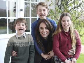Photoshopped image of Kate, Princess of Wales with her children, Prince Louis, left, Prince George and Princess Charlotte.