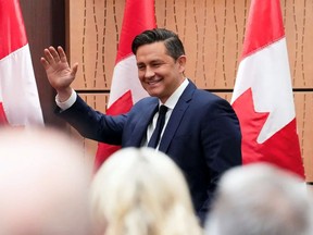 Conservative Leader Pierre Poilievre arrives to address the national Conservative caucus on Parliament Hill in Ottawa on Sunday, Jan. 28, 2024.