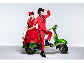 The two members of Japanese pop group angela on a scooter.