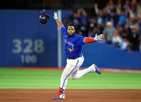 TORONTO, ON - SEPTEMBER 26: Vladimir Guerrero Jr. #27 of the Toronto Blue Jays celebrates his walk-off RBI single in the 10th inning for a 3-2 win against the New York Yankees at Rogers Centre on September 26, 2022 in Toronto, Ontario, Canada. (Photo by Vaughn Ridley/Getty Images)