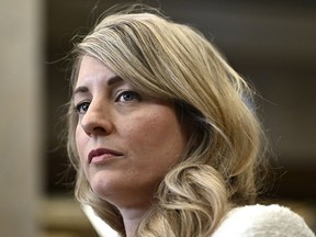 The Canadian government is imposing new sanctions on two Iranians it accuses of participating in the violent repression of women and girls in Iran. Foreign Affairs Minister Mélanie Joly made the announcement Friday to mark International Women's Day.