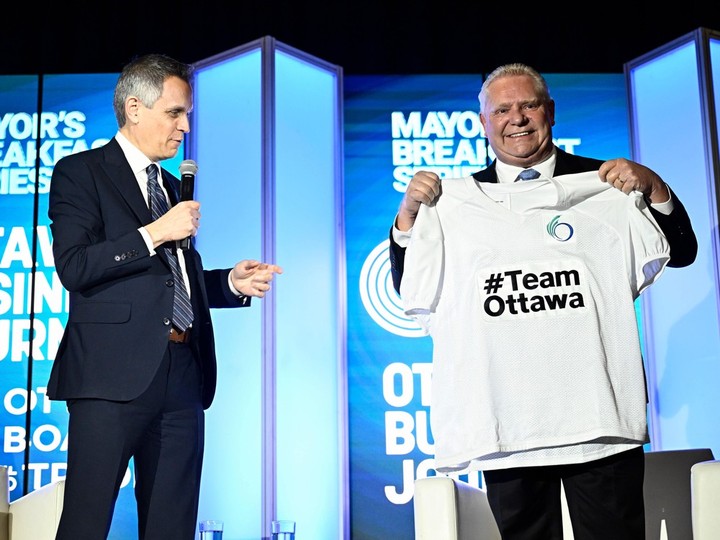  Premier of Ontario Doug Ford receives a customized sports jersey from Ottawa Mayor Mark Sutcliffe at the Ottawa Board of Trade’s Mayor’s Breakfast Series, in Ottawa, on Thursday, March 28, 2024.