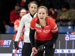 Canada skip Rachel Homan calls a shot as Switzerland skip Silvana Tirinzoni looks on during World Women's Curling Championship