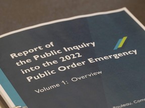 A copy of Justice Paul Rouleau's report on the Liberal government's use of the Emergencies Act, is shown in Ottawa, Friday, Feb.17, 2023. The federal government is open to possible changes to the Emergencies Act but says it first wants to consult widely on the law it invoked to quell protests two years ago.